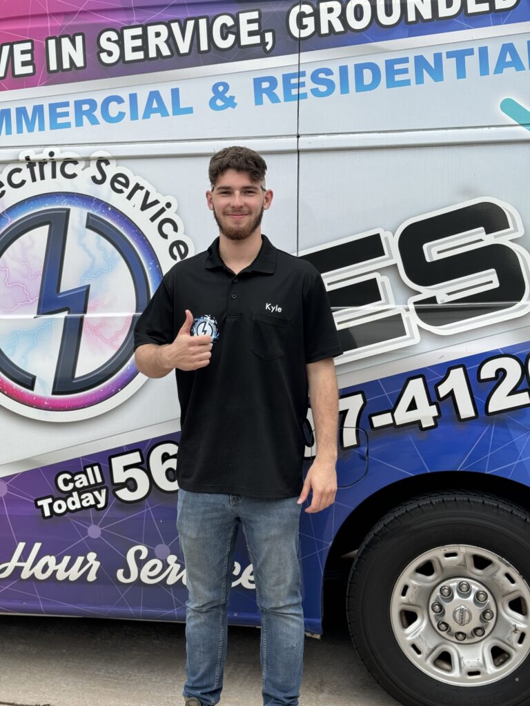 Certified Electrician David from Ochoa Electric Services stands by the service van, ready to provide commercial electrical services in Martin County, FL.